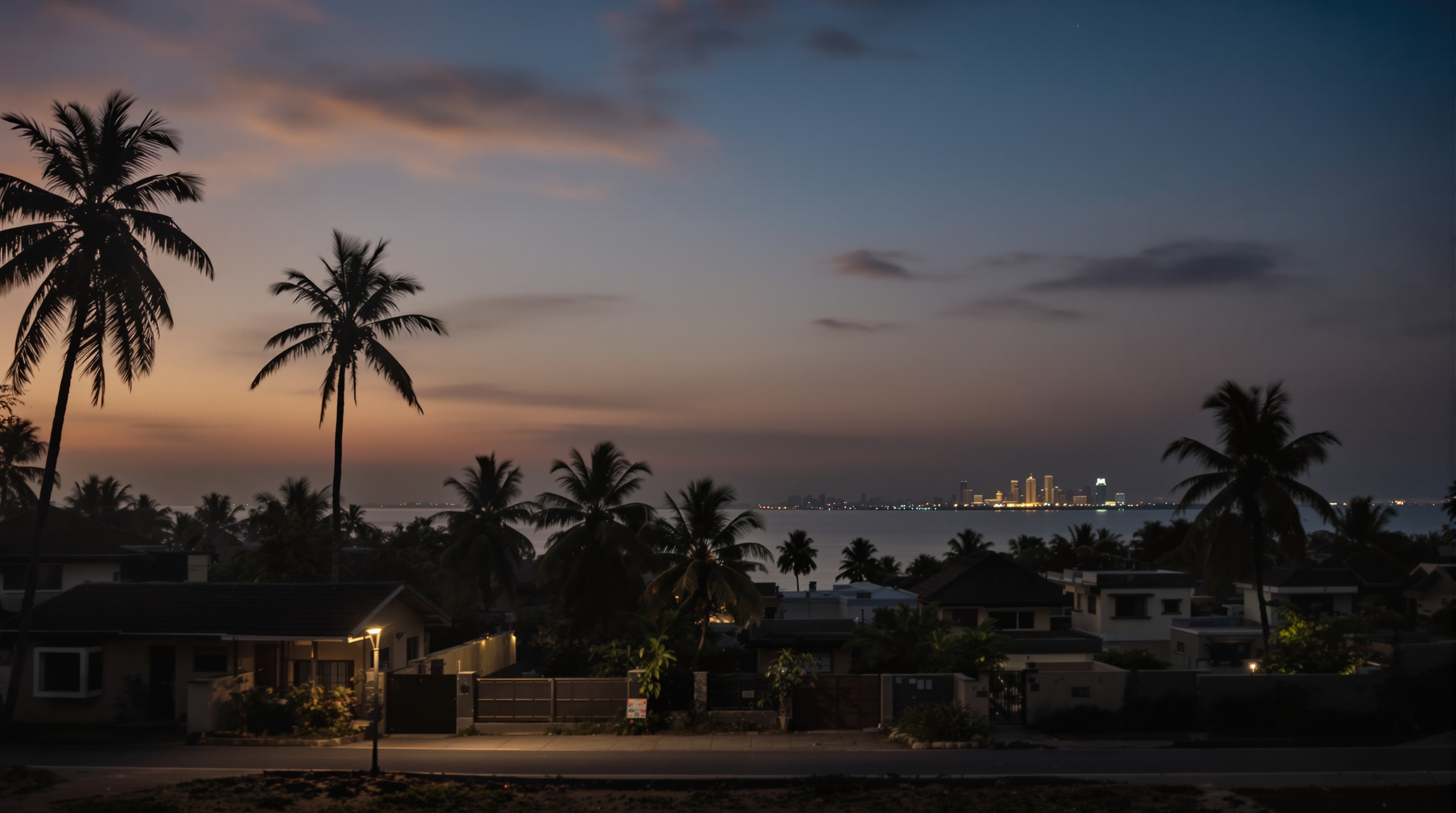 Eruvadi at dusk with a distant Gulf-city skyline suggested on the horizon, symbolising its diaspora